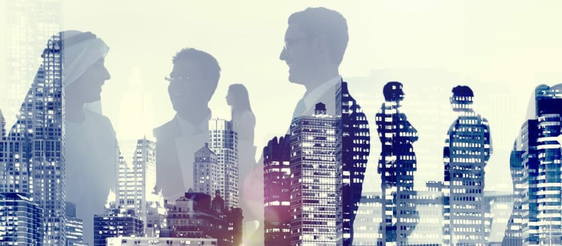 two men and woman figures standing in front of a busy city skyline made of silhouettes of their partners in office